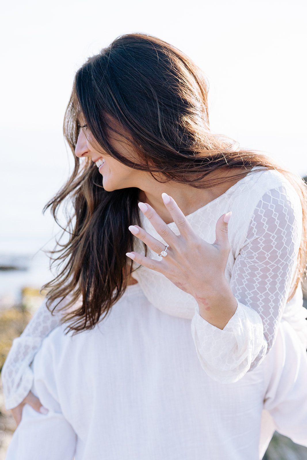 Engagement photos with rocky coastline and soft sky at Kettle Cove Cape Elizabeth Maine