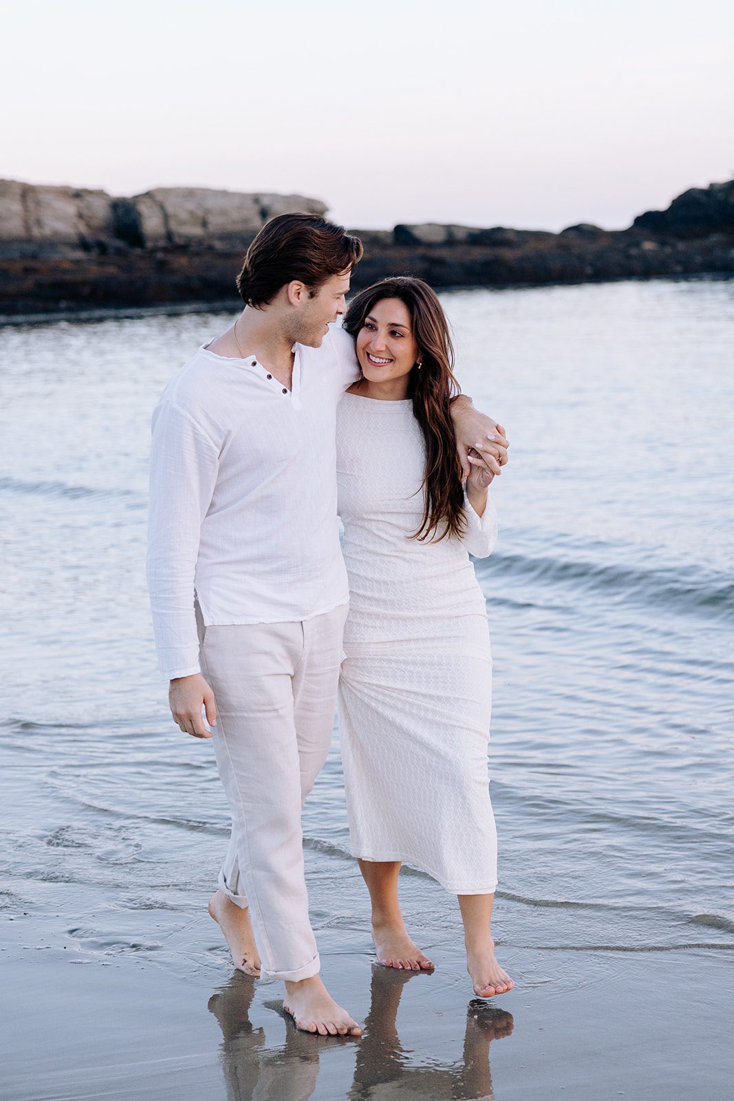 Couple enjoying quiet moment by the ocean during Kettle Cove Maine engagement session